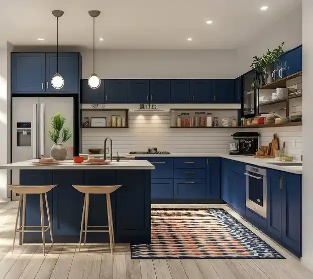 Modern kitchen with navy blue cabinets and white countertops. An island with two wooden stools, pendant lights, and a colorful rug add warmth.